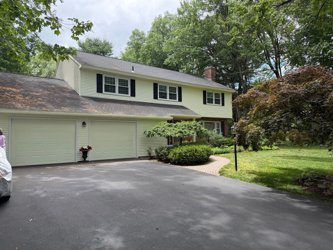After photo of the Exterior Repaint in Delmar, NY — garage side with fresh yellow siding