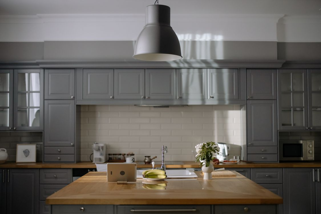 Gray painted wood kitchen cabinets