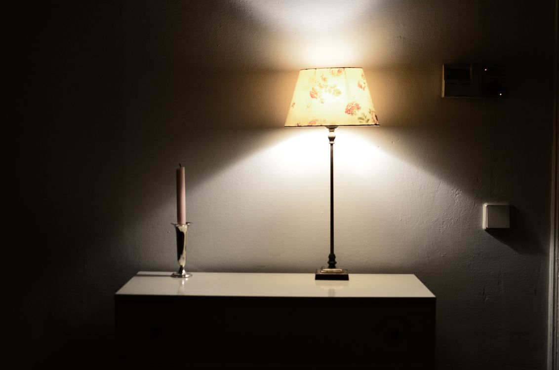 Vintage painted dresser with lamp in a Delmar, NY bedroom